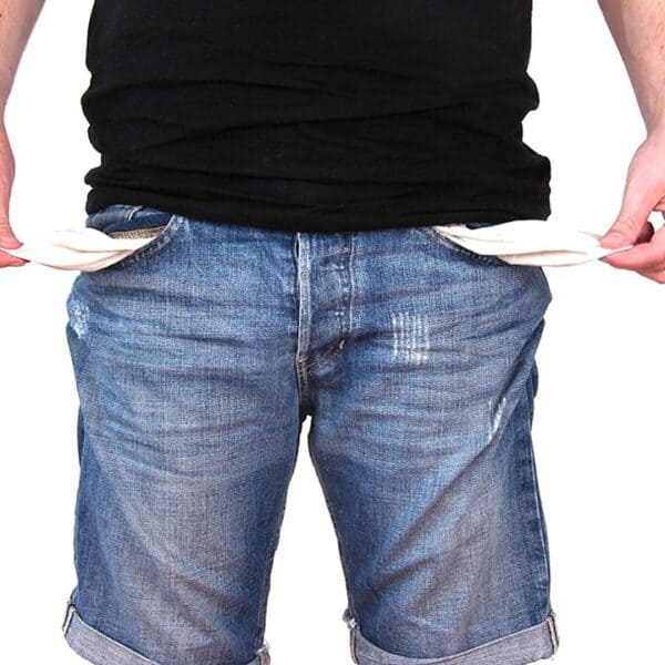Man showing empty pockets in his jeans