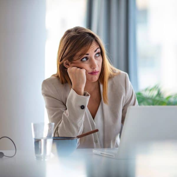 Young businesswoman looking bored