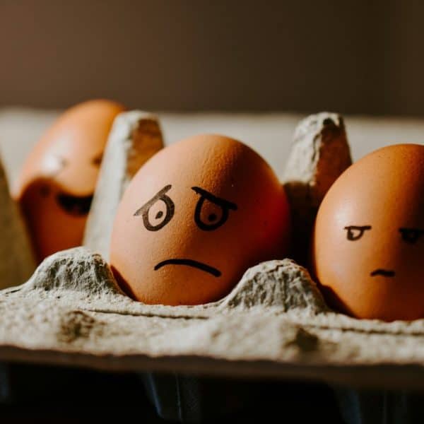 eggs with different unhappy faces drawn on them